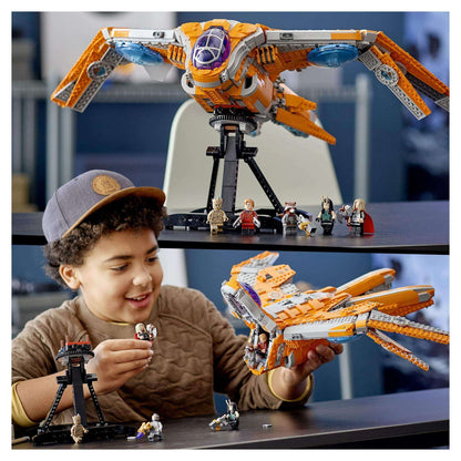 Child playing with LEGO® Marvel Guardians’ Ship set 76193, showcasing an iconic spaceship from Avengers.