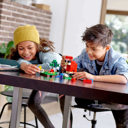 Kids building with LEGO® blocks, creating adventures with the Wool Farm Set 21153, smiling and having fun.