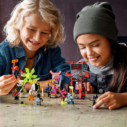 Two children playing with LEGO® NINJAGO minifigures set 71708 in a creative market scene.