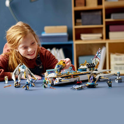 Child playing with LEGO® NINJAGO Hydro Bounty Submarine Set 71756 with minifigures on a table