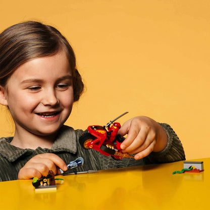 Child enjoying LEGO NINJAGO Legacy Kai’s Blade Cycle Set 71734 with motorcycle toy and minifigures.