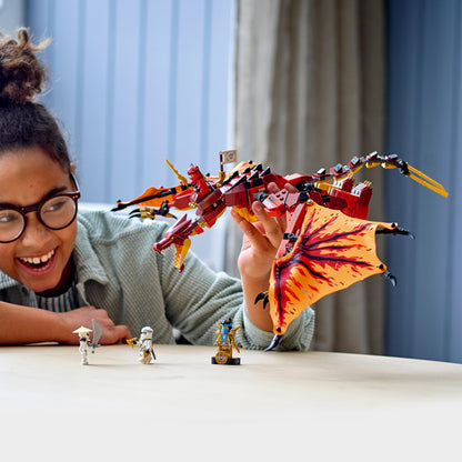Child playing with LEGO® NINJAGO Legacy Fire Dragon Attack Toy 71753, showcasing its posable dragon features.