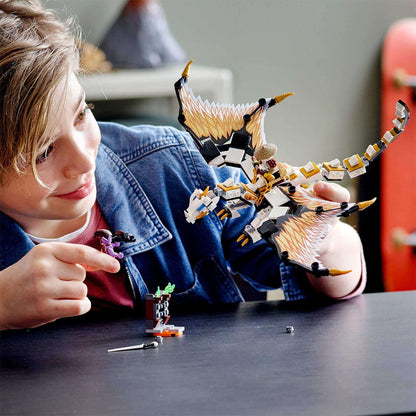 Child playing with LEGO® NINJAGO Wu's Battle Dragon Toy, staging a battle with Hero Wu and Gleck.
