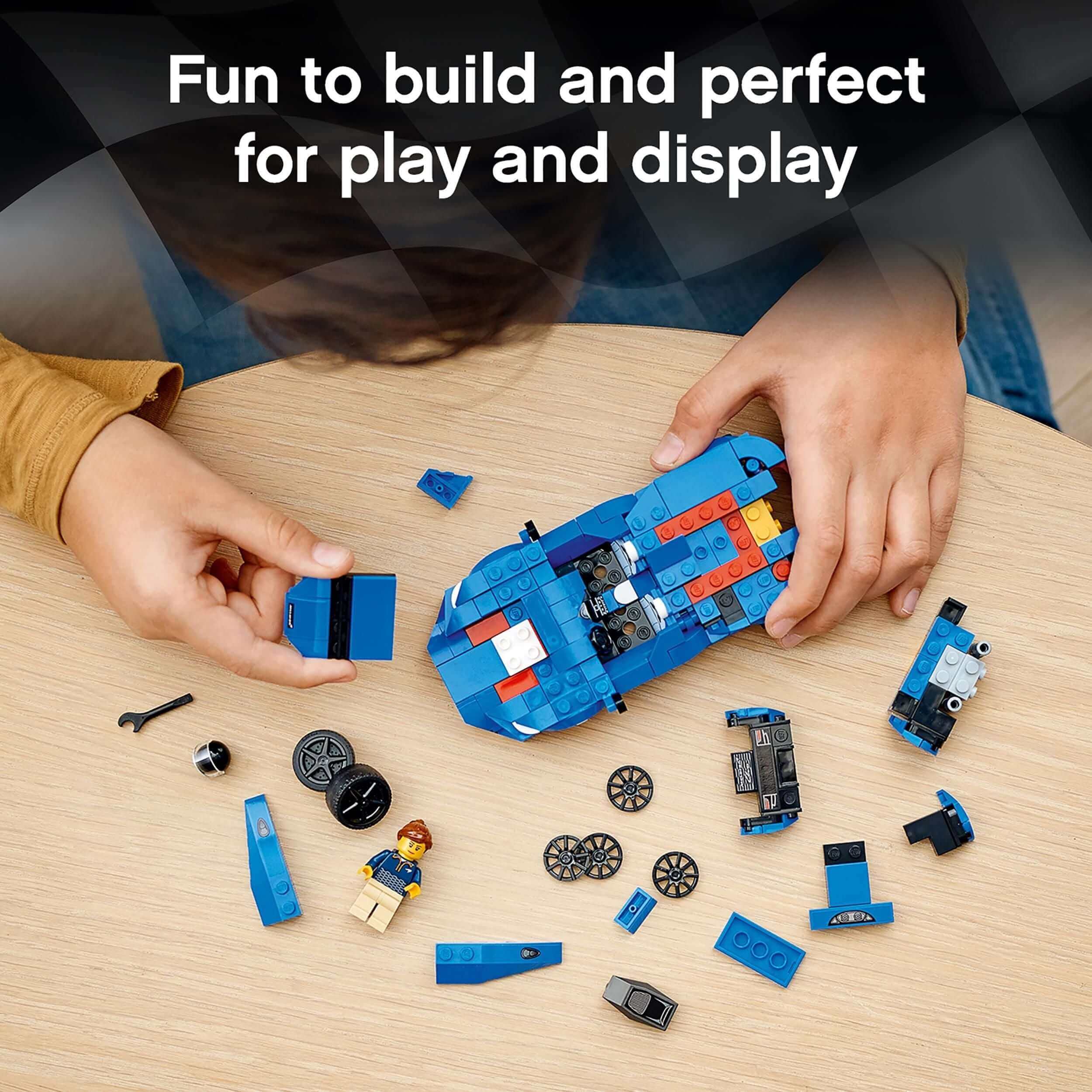 Child assembling LEGO® McLaren Elva with colorful blocks, showcasing creativity and fun for play and display.