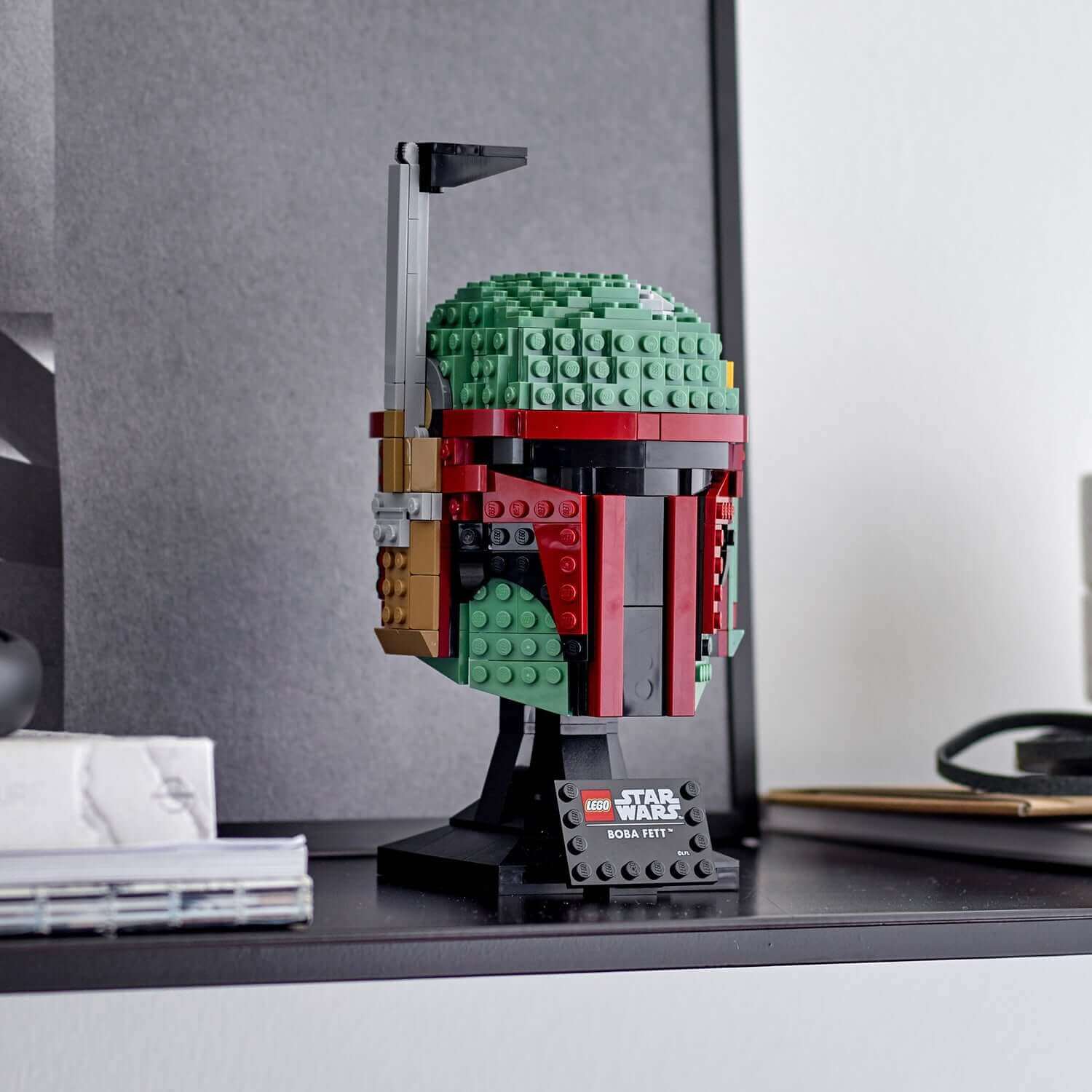 LEGO Star Wars Boba Fett Helmet Building Set 75277 displayed on a shelf, perfect for collectors and advanced builders.