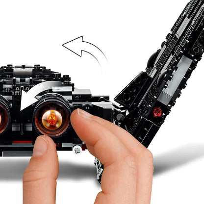 Child's hand interacting with LEGO Star Wars Kylo Ren's Shuttle, showcasing movable features and exciting design.
