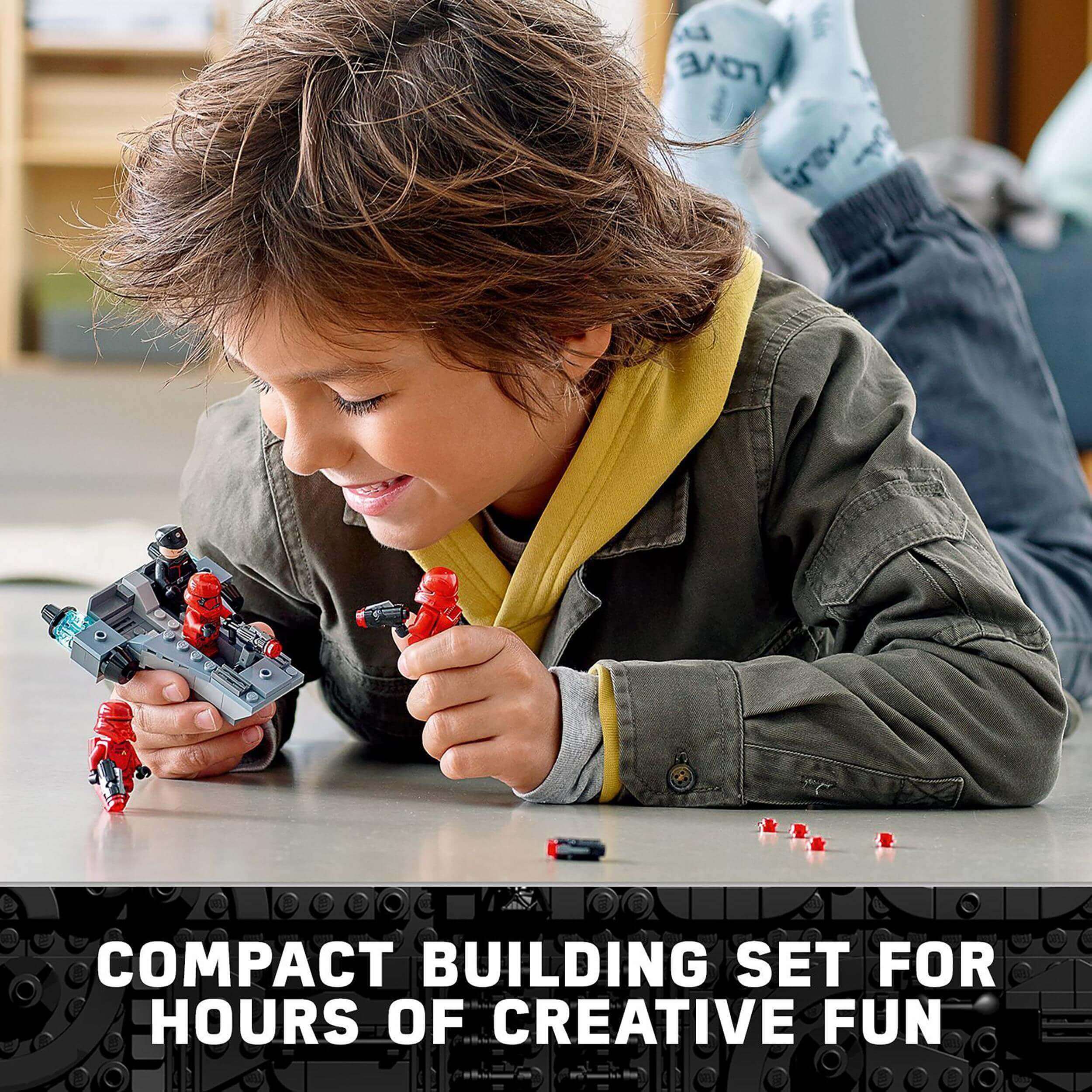 Child playing with LEGO Star Wars Sith Troopers Battle Pack 75266, enjoying creative role-play fun and building an army.