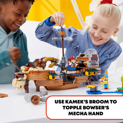 Kids building the LEGO® Super Mario Bowser Airship, using Kamek's broom in an exciting play scenario.