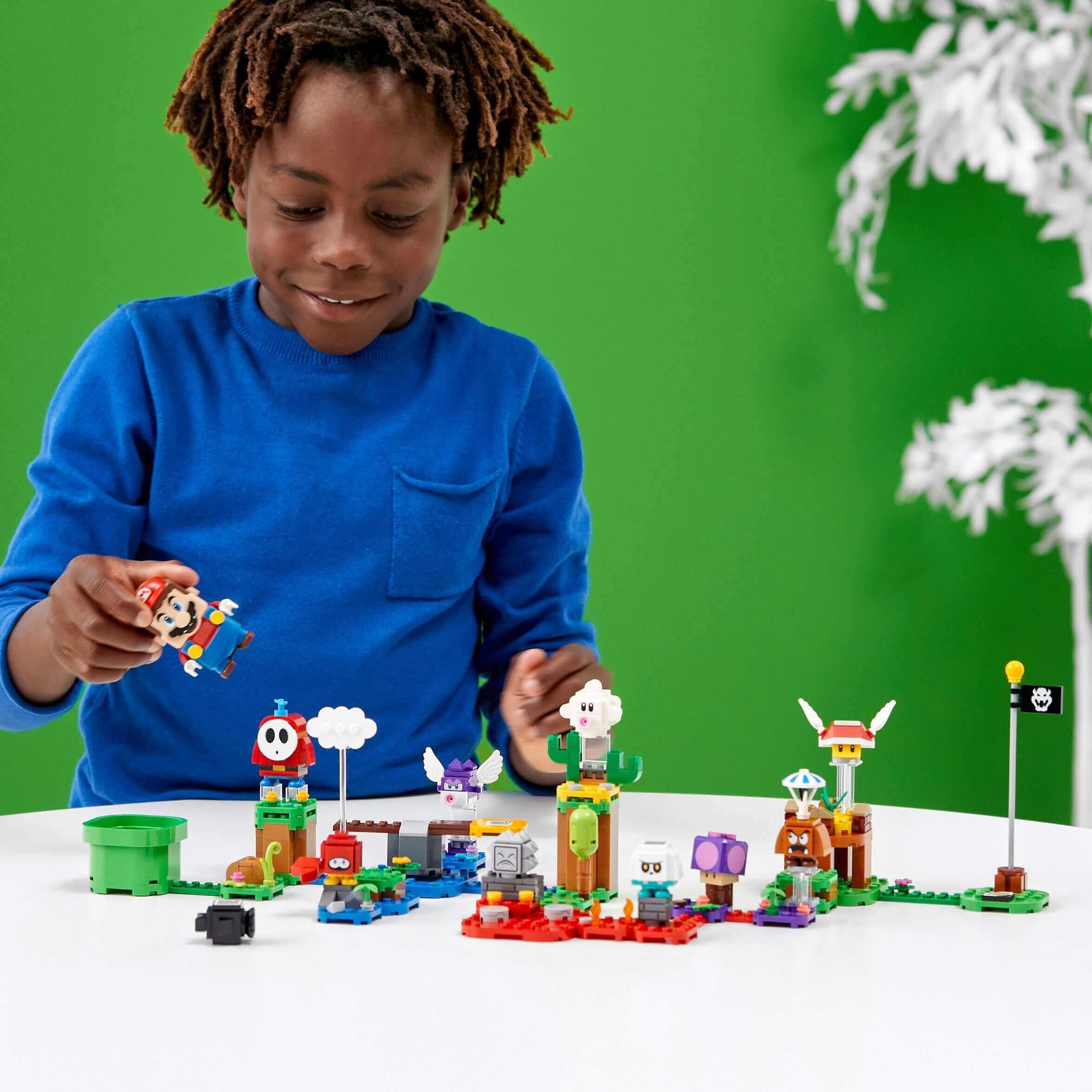 Child playing with LEGO® Super Mario Character Packs – Series 2, featuring buildable characters and fun levels.