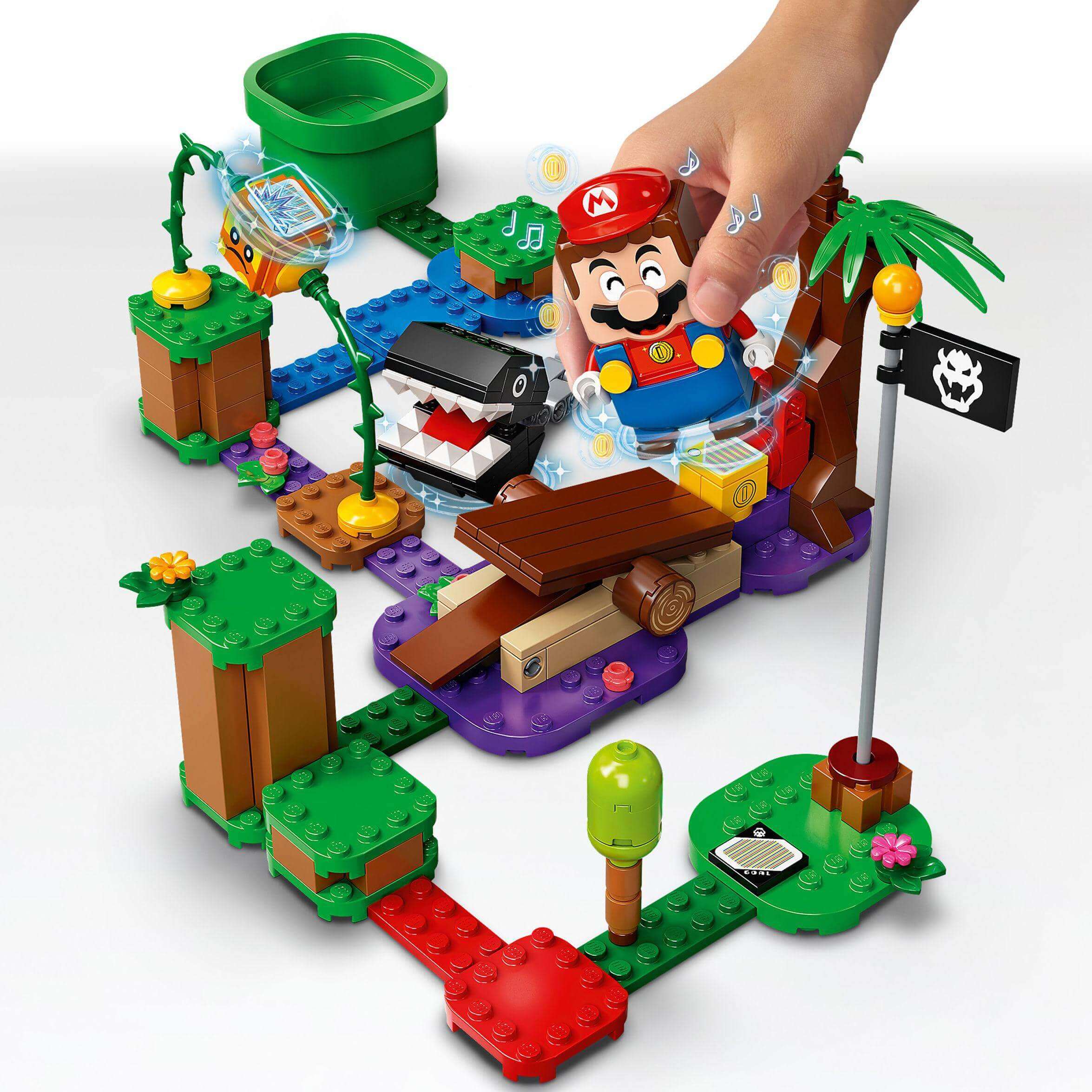 Child interacting with LEGO® Super Mario Jungle Encounter Expansion Set 71381, featuring Chain Chomp and interactive elements.
