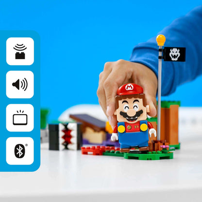 Child playing with LEGO® Mario figure in the Jungle Encounter Expansion Set 71381, featuring interactive game elements.