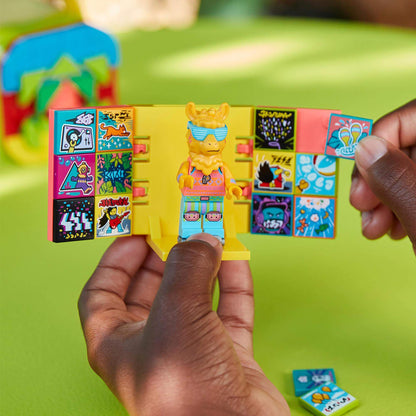 Child holding LEGO® VIDIYO™ Party Llama figure with colorful stickers in vibrant setting, ready to create music videos.