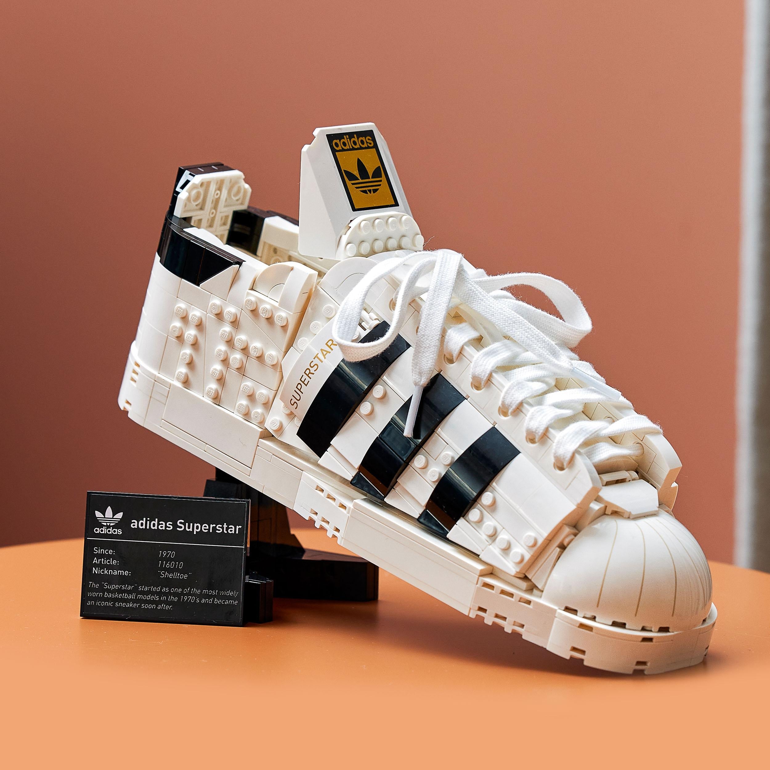 LEGO® adidas Originals Superstar Set 10282 showcasing a detailed model of the iconic trainer with black stripes.