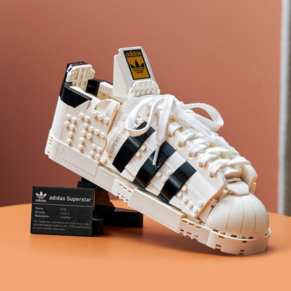 LEGO® adidas Originals Superstar Set 10282 showcasing a detailed model of the iconic trainer with black stripes.