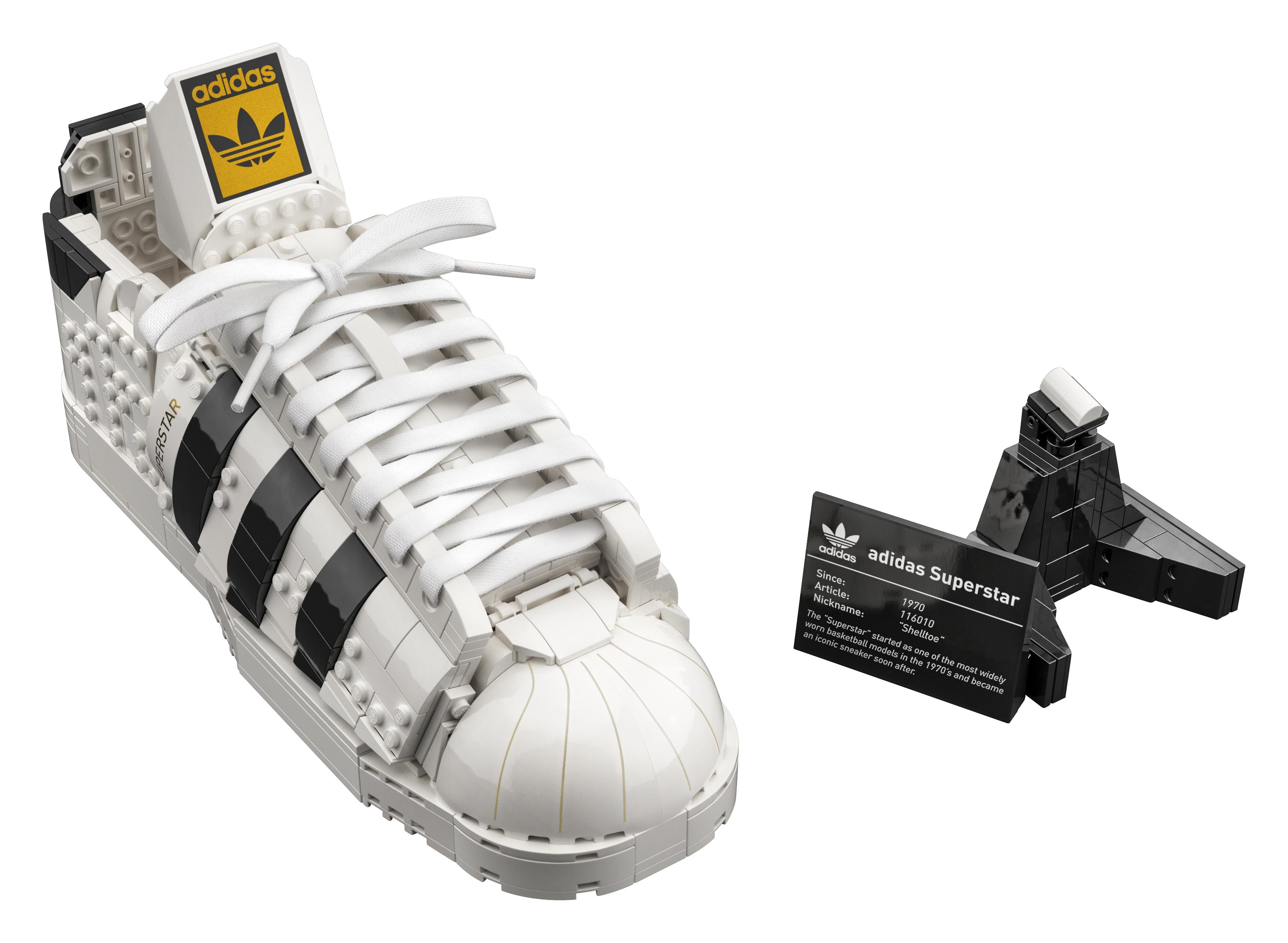 LEGO® adidas Originals Superstar Set 10282 displayed with a detailed replica of the iconic trainer and information plaque.