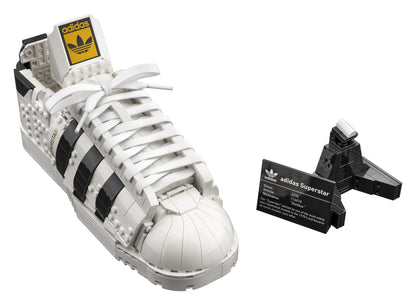 LEGO® adidas Originals Superstar Set 10282 displayed with a detailed replica of the iconic trainer and information plaque.