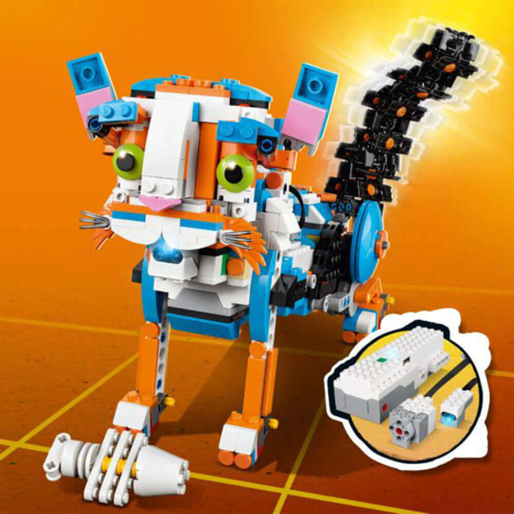 Colorful LEGO BOOST cat robot model with motorized tail and sensor, perfect for kids learning coding and robotics.