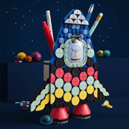 Colorful LEGO® DOTS Pencil Holder in rocket shape, designed for kids with storage and display space for craft supplies.