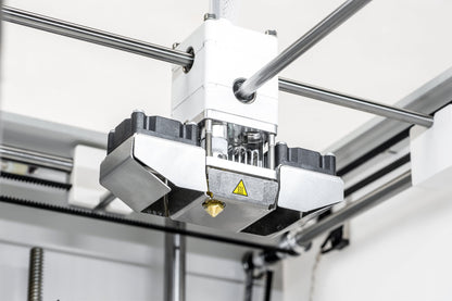 Close-up of Ultimaker 2+ Connect's print head assembly for high-quality 3D printing prototypes.
