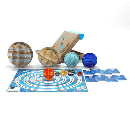 OzoGoes to the Solar System STEAM kit with planet figurines and educational game board for learning activities.