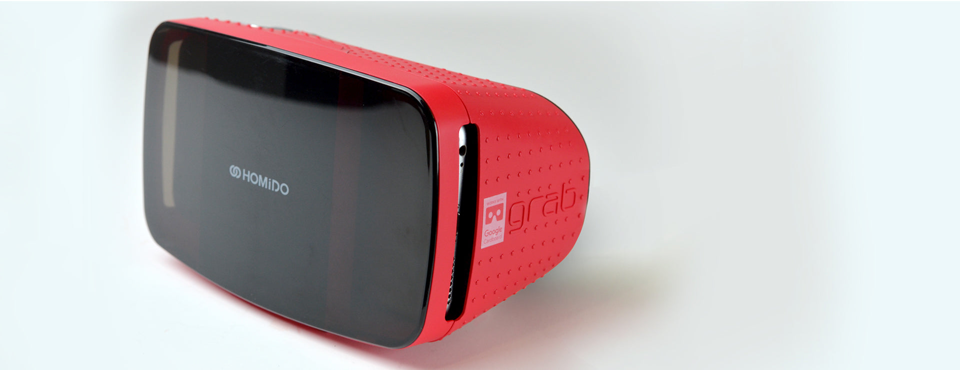 Homido Grab VR Viewer in red, designed for immersive VR experiences in classroom settings.