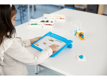 Child using tablet for hands-on STEAM learning with LEGO Education SPIKE Essential Set 45345.