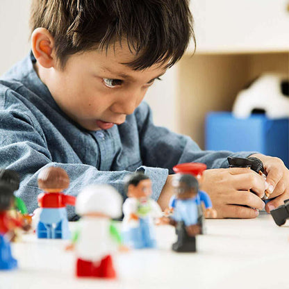 Child engaging with LEGO DUPLO figures from the Community People Set, exploring roles and occupations.