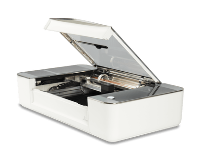 Glowforge Plus 3D laser printer with lid open, showcasing its advanced engraving features and sleek design.