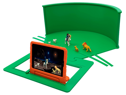 Greenscreenbox tabletop setup with children toys for imaginative role-play and creative digital storytelling.