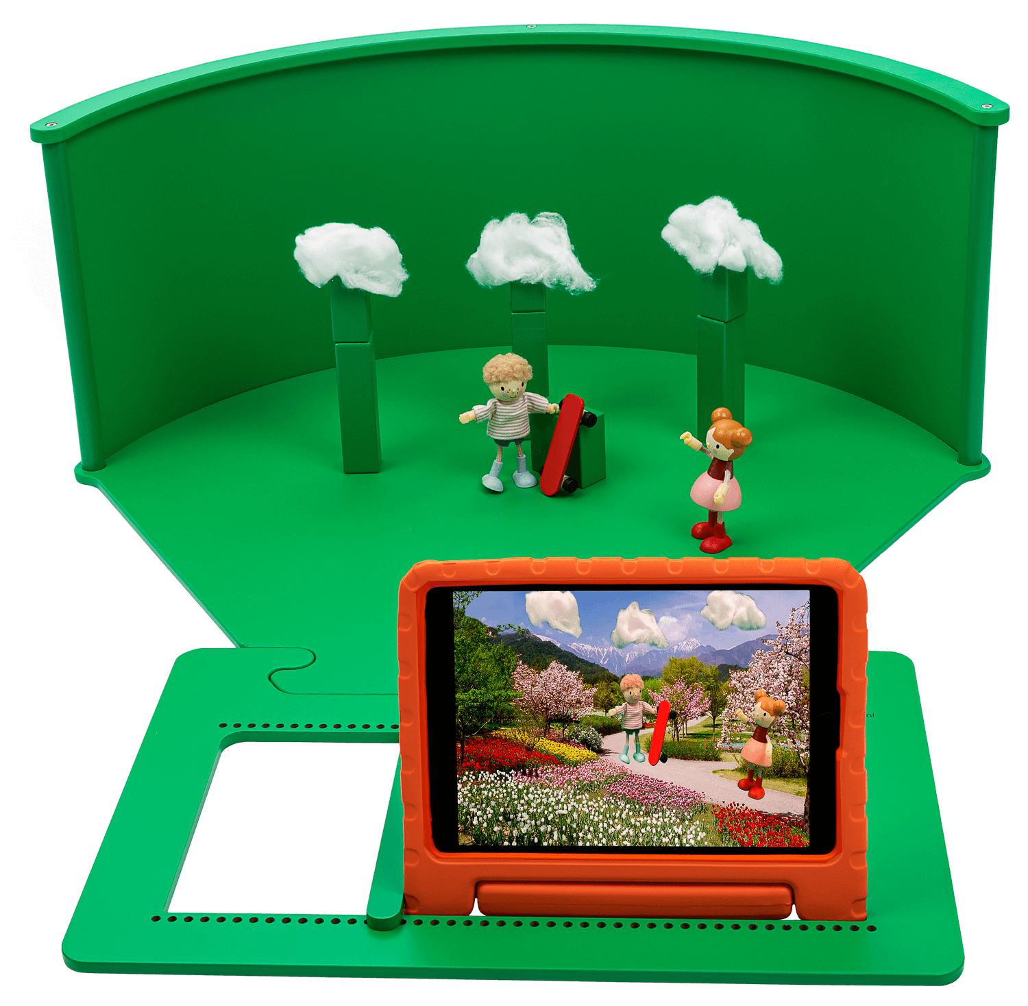 Greenscreenbox for kids role-play, featuring figures, trees, and a tablet displaying creative adventures.