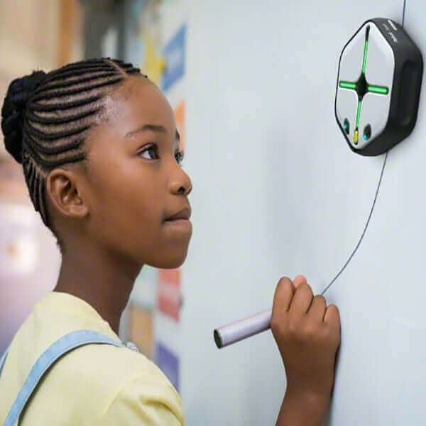 Child using IRobot® Root® Coding Robot on a wall, demonstrating interactive coding and creativity