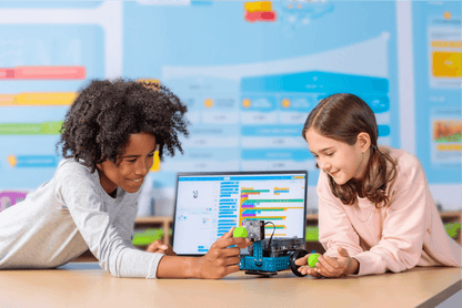 Two students engaging with the Makeblock mBot 2 with Bluetooth Dongle in an educational setting.