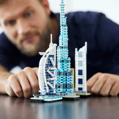 Detailed LEGO® Architecture models of Dubai skyscrapers with a person showcasing the set.