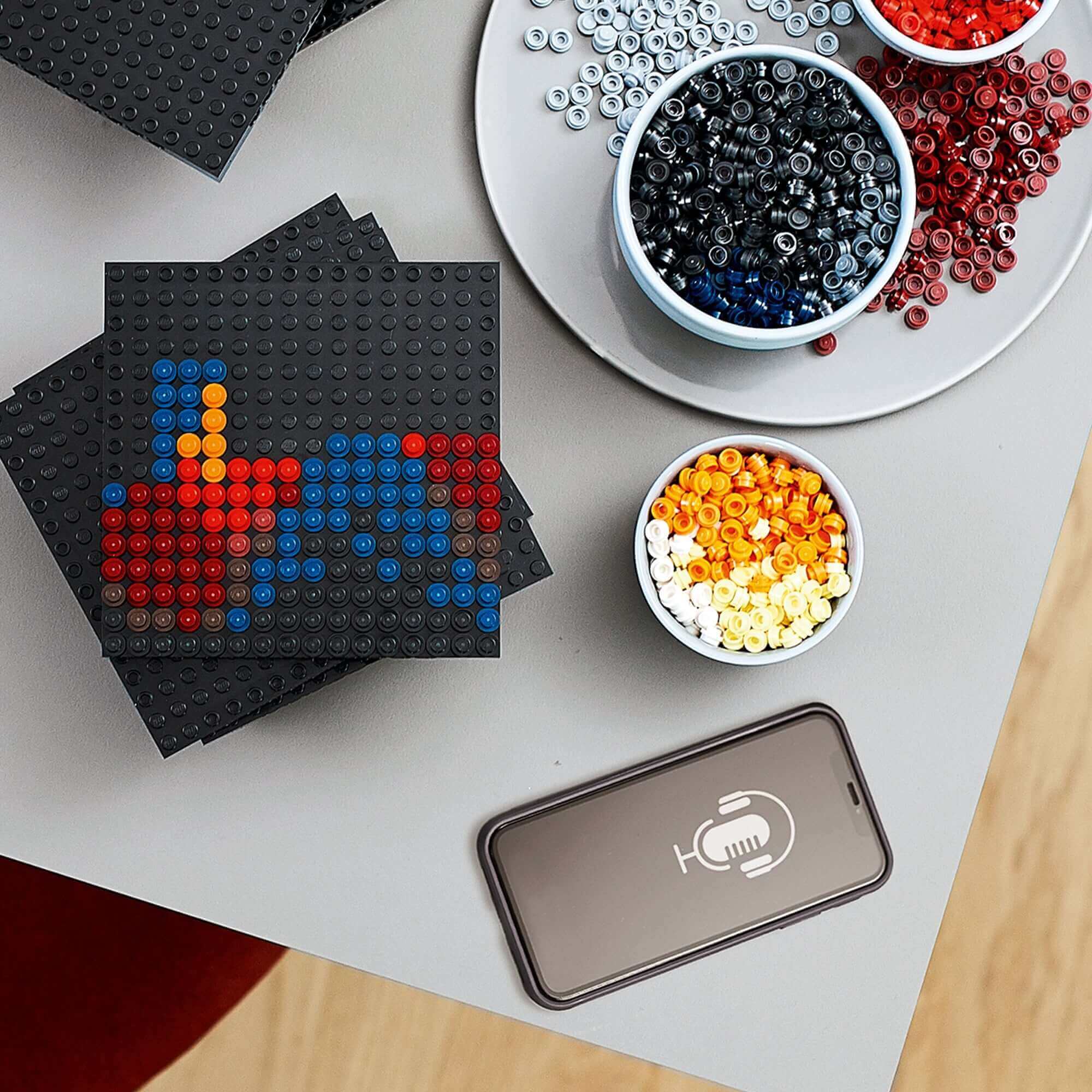 LEGO Art Star Wars The Sith building set components with colorful pieces and smartphone for immersive experience.