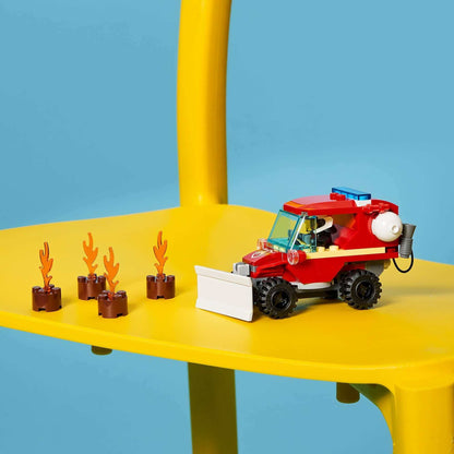 LEGO® City Fire Hazard Truck Toy 60279 with flames, perfect for kids' firefighting pretend play.
