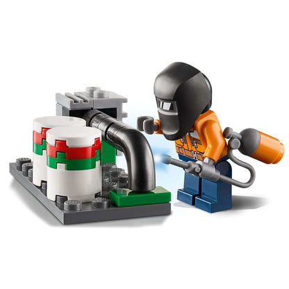 LEGO® City Fire Helicopter Response Set 60248 showing a worker with a gas canister using tools in a fire rescue scenario.