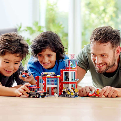 Two children and a man enjoy playing with LEGO® City Fire Station Truck Toy 60215, showcasing creativity and teamwork.