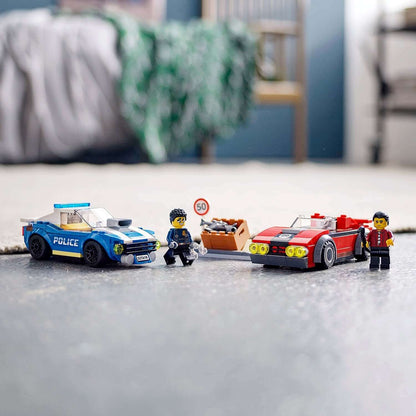 LEGO® City Police Highway Arrest Set 60242 with police car, thief and Duke DeTain figure for kids' playtime adventures.