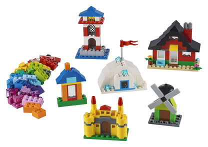 Colorful LEGO® Classic 4+ Bricks and Houses Set 11008 featuring various house designs like an igloo, lighthouse, and castle.