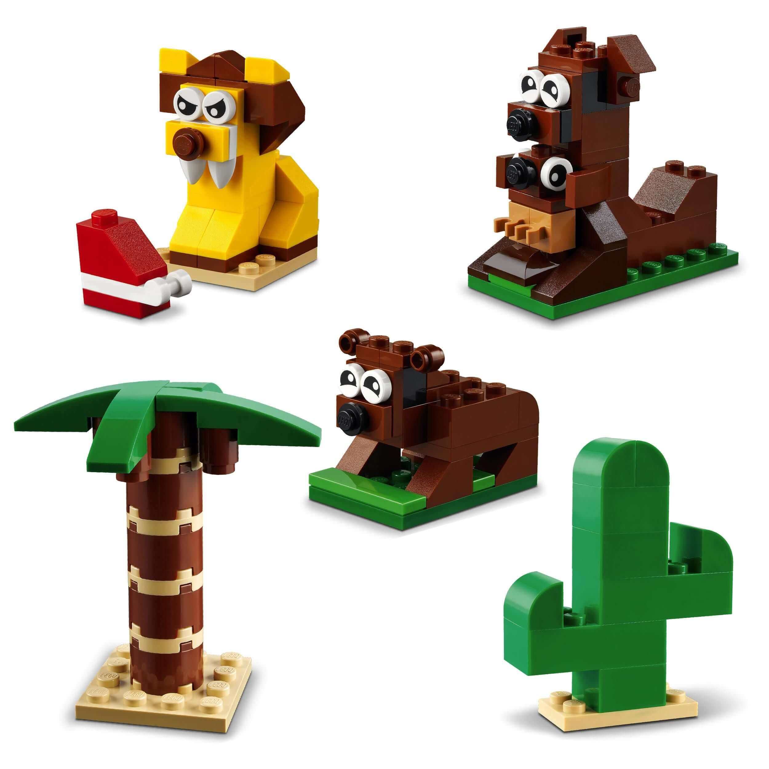 LEGO® Classic Around the World Bricks Set 11015 showing playful animals and tropical plants for kids' creative fun.