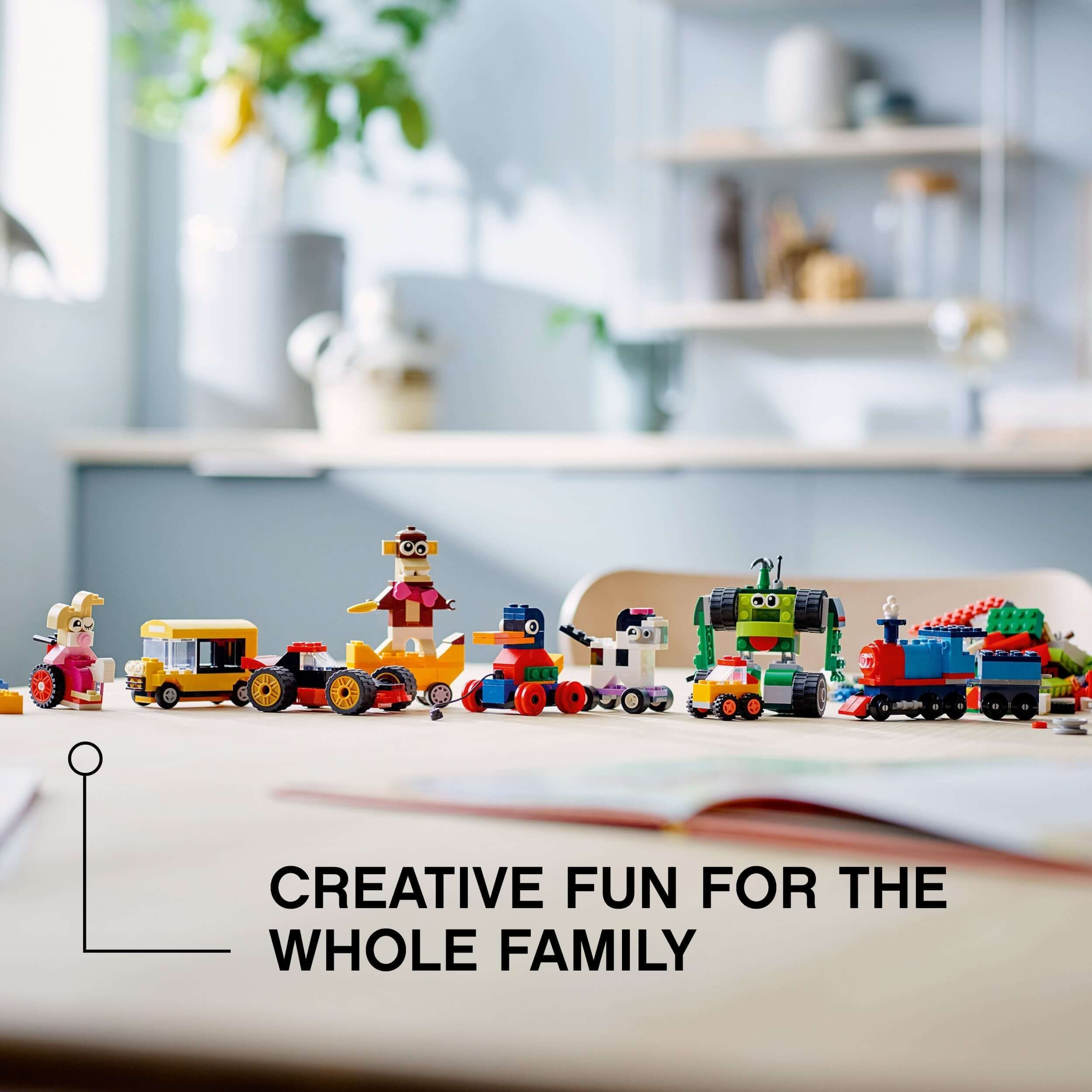 Colorful LEGO® Classic Bricks and Wheels playset with various fun vehicles for creative family activities.