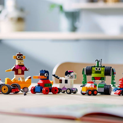 Colorful LEGO® Classic Bricks and Wheels characters including vehicles and figures, inspiring creativity in play.