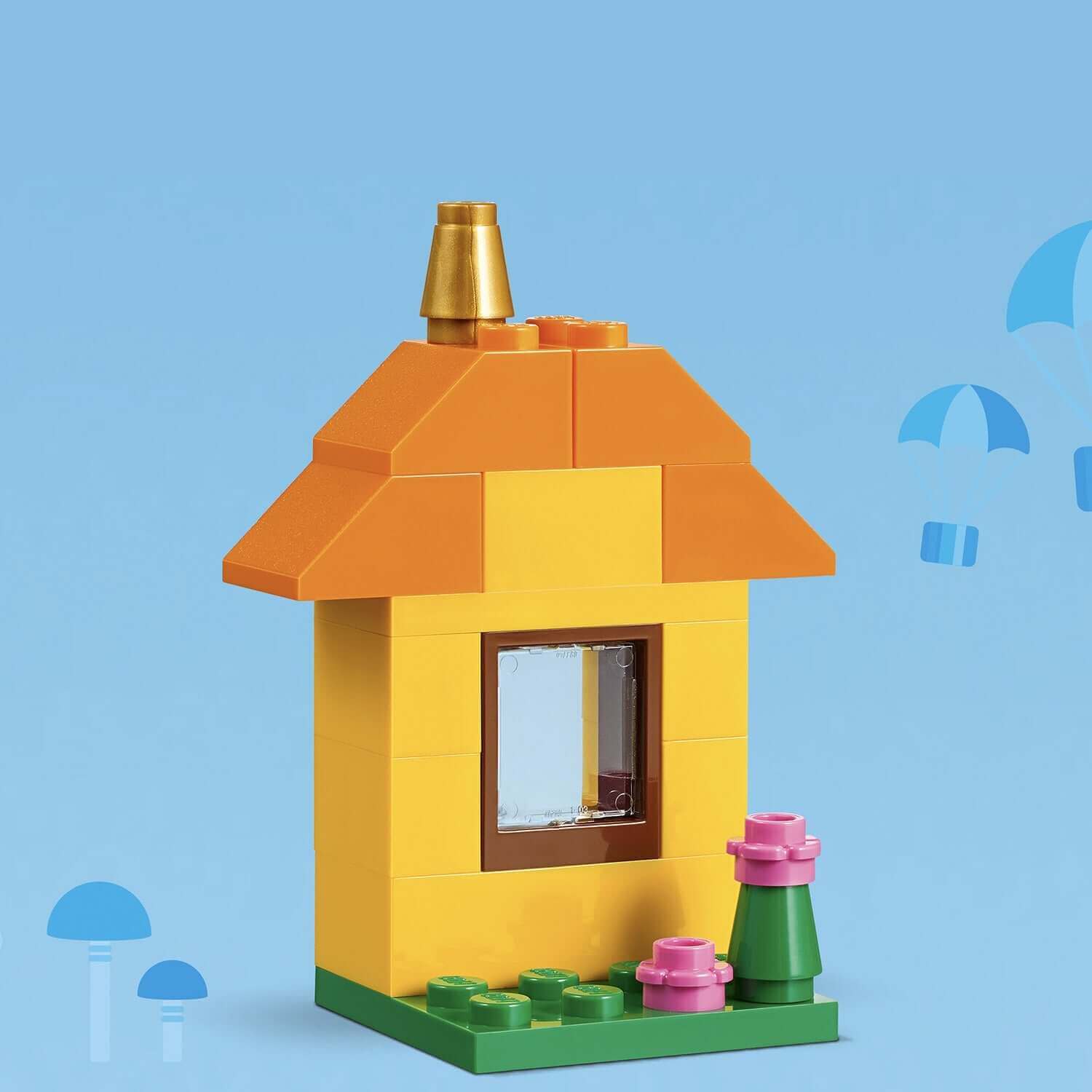 LEGO® Classic Bricks and Ideas construction toy set with an adorable yellow house and flowers.