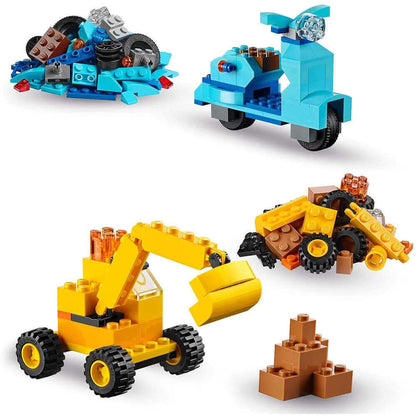Colorful LEGO construction models including a scooter, excavator, and building materials in various shapes.