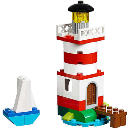 LEGO Classic Creative Bricks lighthouse model featuring red and white design with a boat.