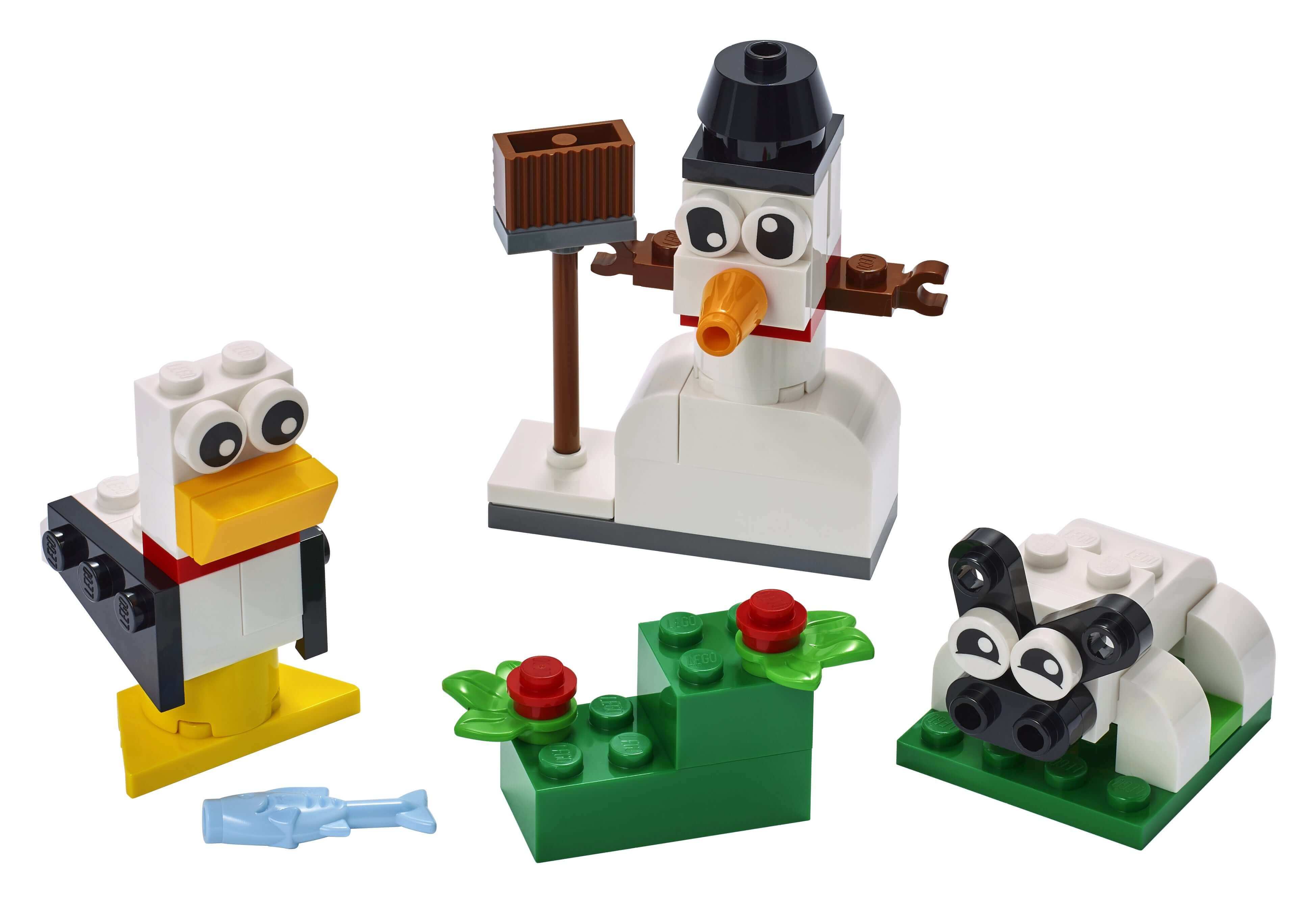 LEGO Classic Creative White Bricks Set 11012 featuring toys of a snowman, sheep, and seagull for imaginative play.