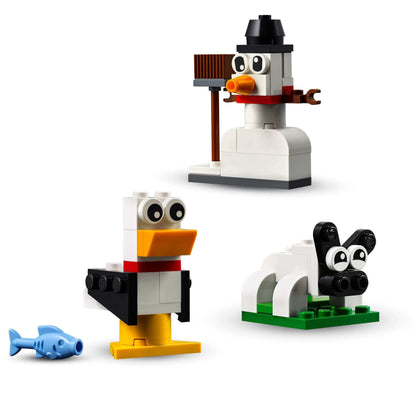 LEGO® Classic Creative White Bricks Set 11012 with a snowman, seagull, and sheep for imaginative building fun.