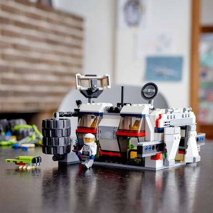 LEGO® Creator 3in1 Space Rover Explorer Set 31107 with astronaut figure and rover on a table, showcasing creative building.
