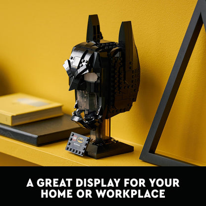 LEGO® DC Batman cowl set displayed on a shelf, ideal for home or workplace decor.