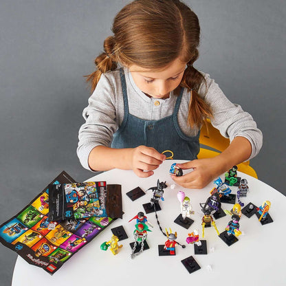 Child playing with LEGO® DC Super Heroes minifigures, showcasing iconic characters and collection accessories.